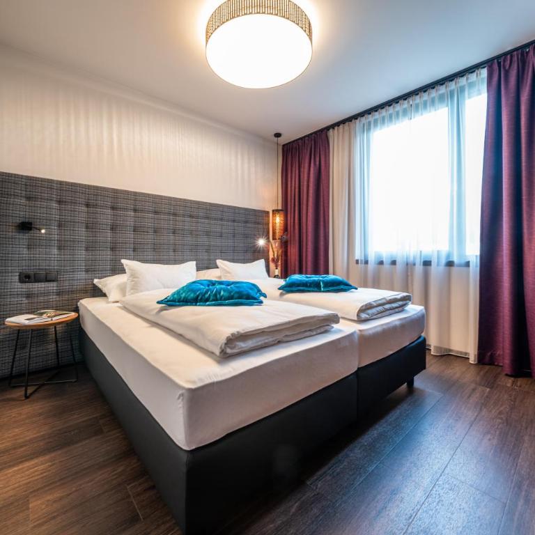 Rufi's Hotel Innsbruck - Deluxe Doppel-/Zweibettzimmer mit Bergblick - 1