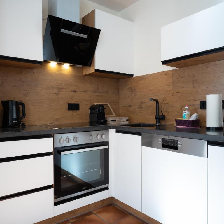 Landhaus Lodges Kaprun by we rent - Apartment mit Gartenblick - 10