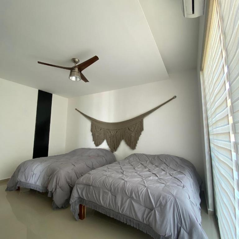 Angelina 28 Beachfront and Family Apartments - Modern and Relaxing Long Stays - 20 min from Cancun Airport - One-Bedroom Apartment with Sea View - 8