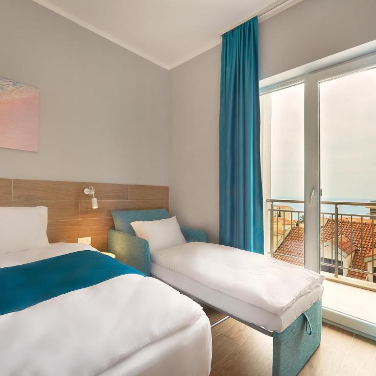 APART Garni Hotel LARIMAR - Deluks Dvokrevetna soba sa Bračnim Krevetom, Balkonom i Pogledom na More - 8