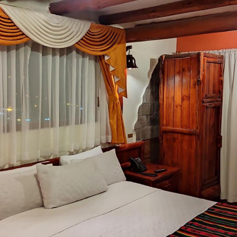 Hotel Maderanegra By Huasicama - Habitación con cama grande y bañera de hidromasaje - 1