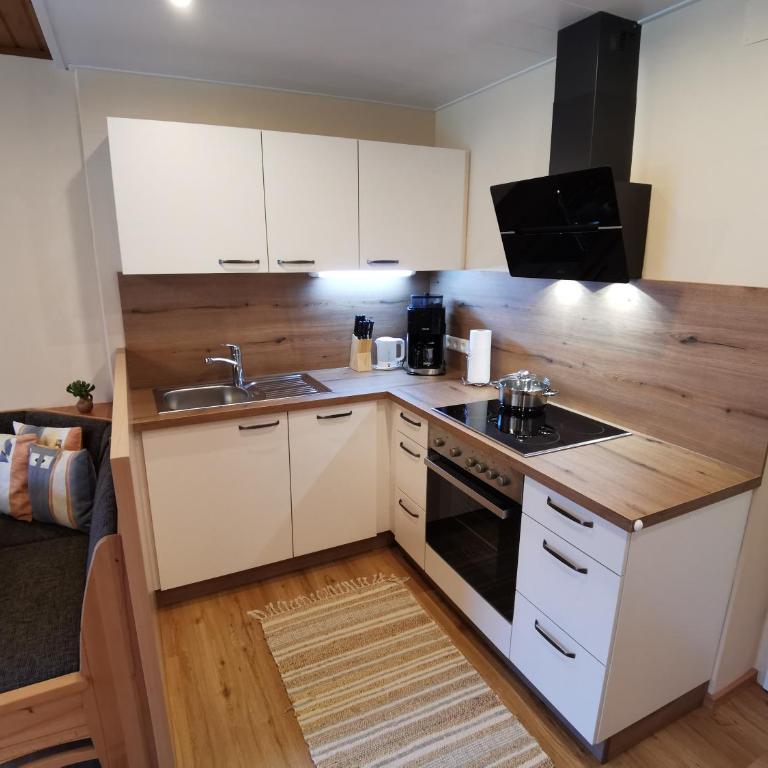Pension & Ferienwohnung Sonnleiten - Apartment mit 2 Schlafzimmern, einem Balkon und Gartenblick - 7