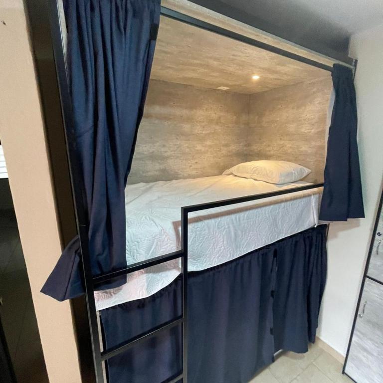 HOSTAL XAO - Cama en habitación compartida con 4 camas - 1