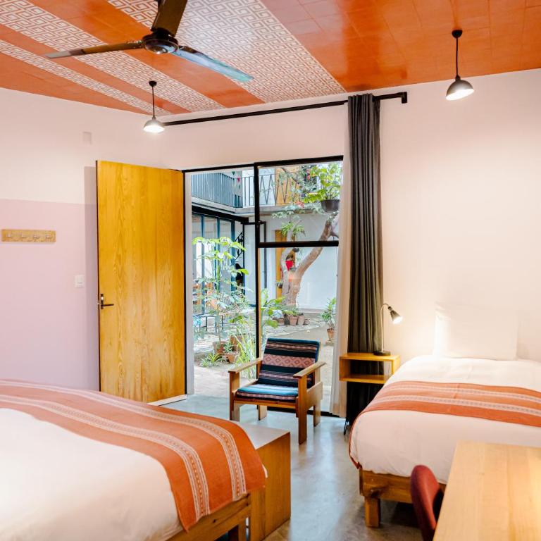 Hotel con Corazón Oaxaca - Habitación con cama extragrande y cama supletoria - 10