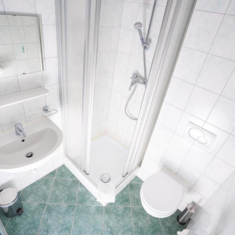 das Cityhouse - Dreibettzimmer mit Balkon - 16