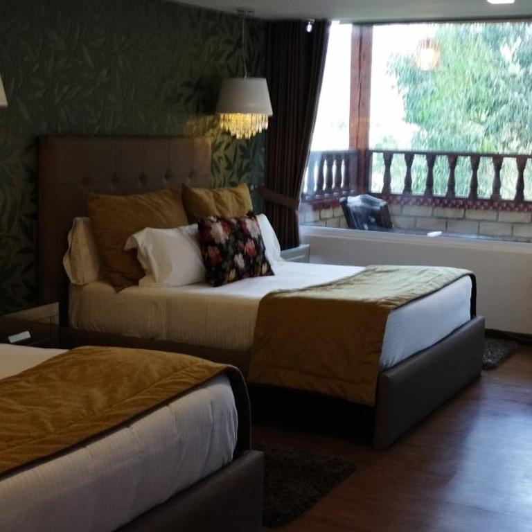 Hotel Boutique Guatika - Suite con cama grande y balcón - 4