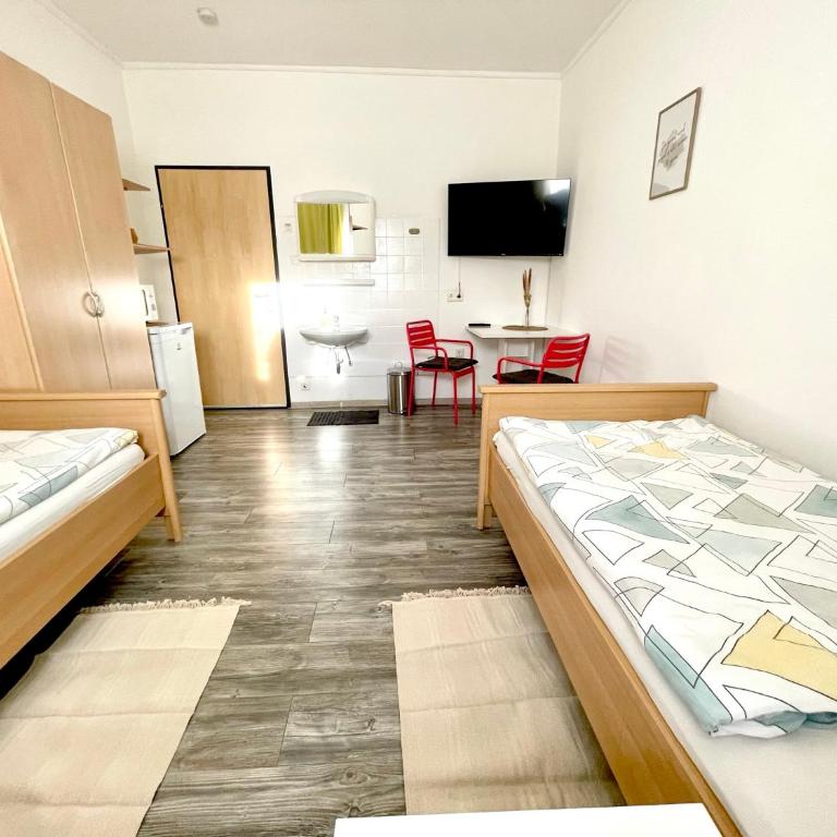 SmartRooms24 - Zweibettzimmer mit Gemeinschaftsbad - 9