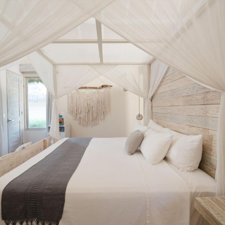 Kai Tulum - Suite con cama grande y vistas parciales al mar - 4