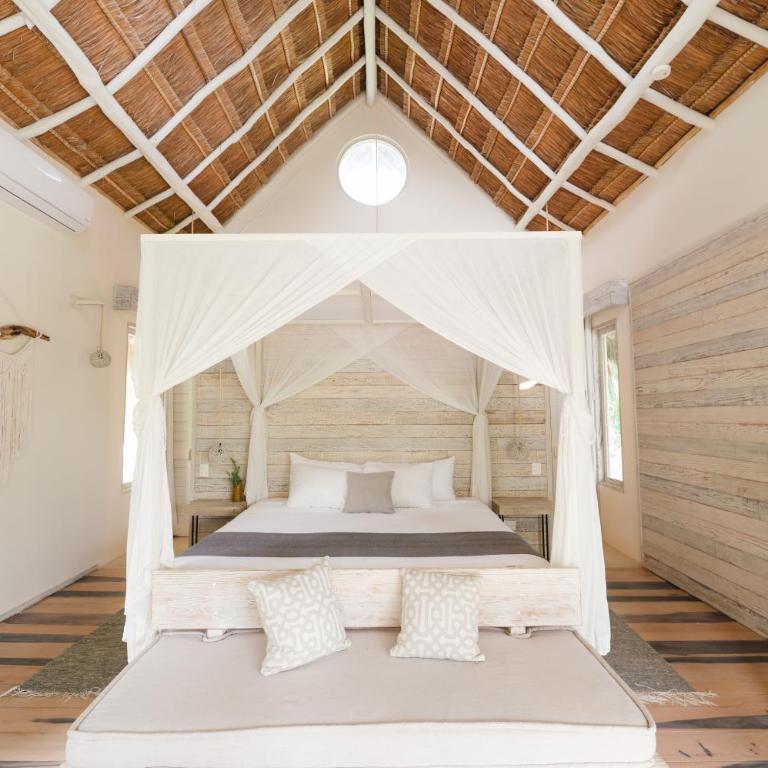 Kai Tulum - Suite con cama grande y vistas parciales al mar - 8