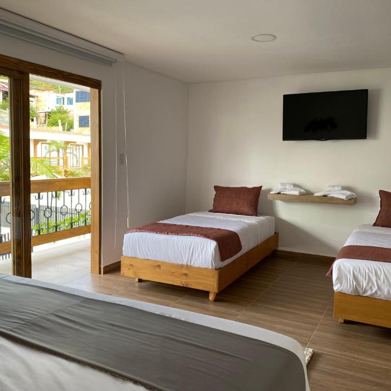 Hotel Gran Plaza San Agustin - Habitación Cuádruple Deluxe - 4