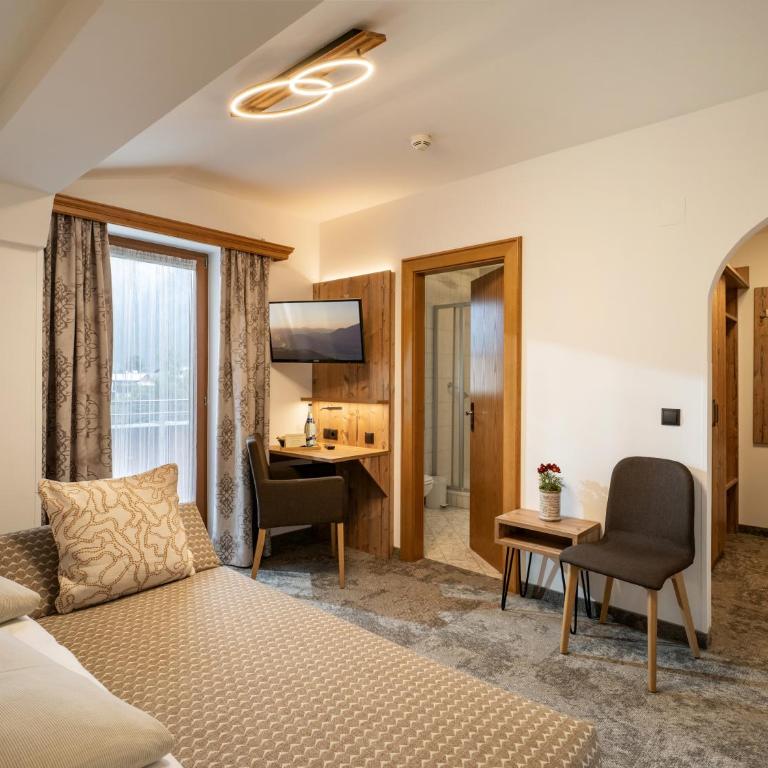 Hotel Garni Ferienhof - Deluxe Zimmer mit Schlafsofa - 13