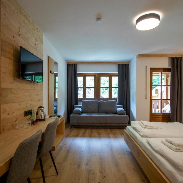 Sporthotel Dachstein West - Deluxe Dreibettzimmer - 1