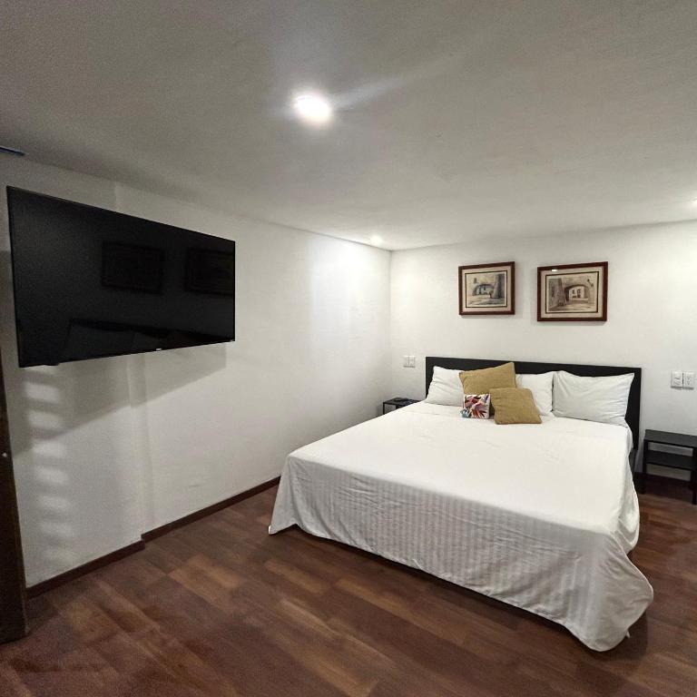 Lindas Suites Eugenio Sue - King Room - 9