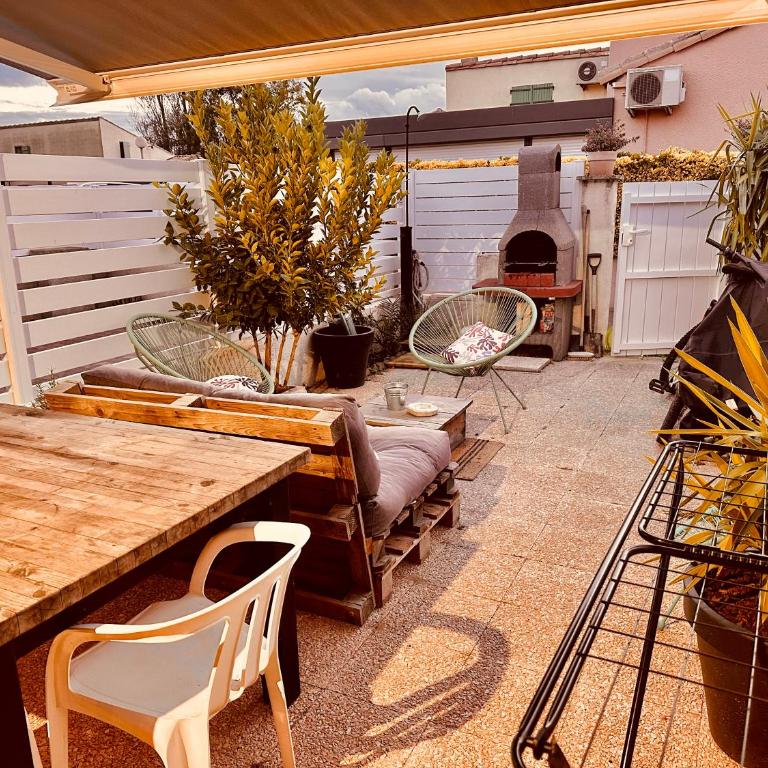 Résidence Le SUNSET Marseillan-plage, entre mer, canal du midi et lagune de Thau, étape vélo, famille, couple, VRP, toutou admis, jardin, parking privé gratuit, vélos, Clim, WIFI fibre gratuite, commodités, plage et piste cyclable à proximité - Apartamento de 2 dormitorios - 32