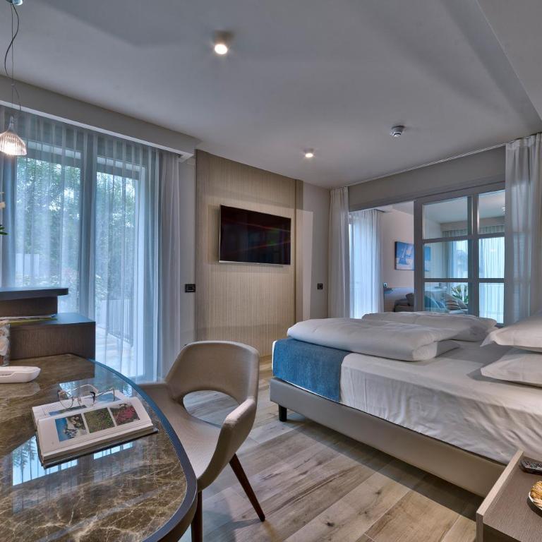 Villa Remo by Hotel Galvani - Suite mit Kingsize-Bett, Terrasse und Seeblick - 1