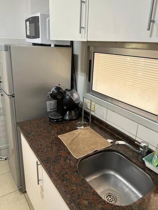 Semipiso Panoramico 2 habitaciones amplia cocina lavadero Parrilla y Cochera privada incluida a metros del subte - Apartamento Deluxe - 66