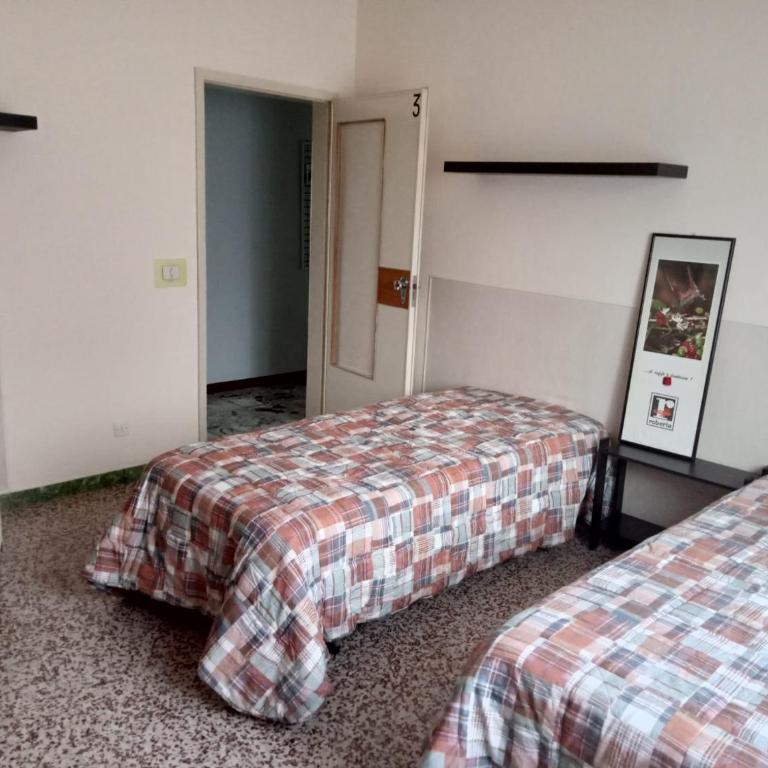 Casa Mawi - Camera Standard Doppia con Letti Singoli con Bagno in Comune - 1