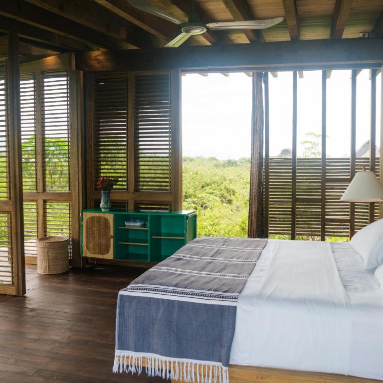 Punta Pajaros Hotel - Habitación con cama grande y vistas al mar - 2