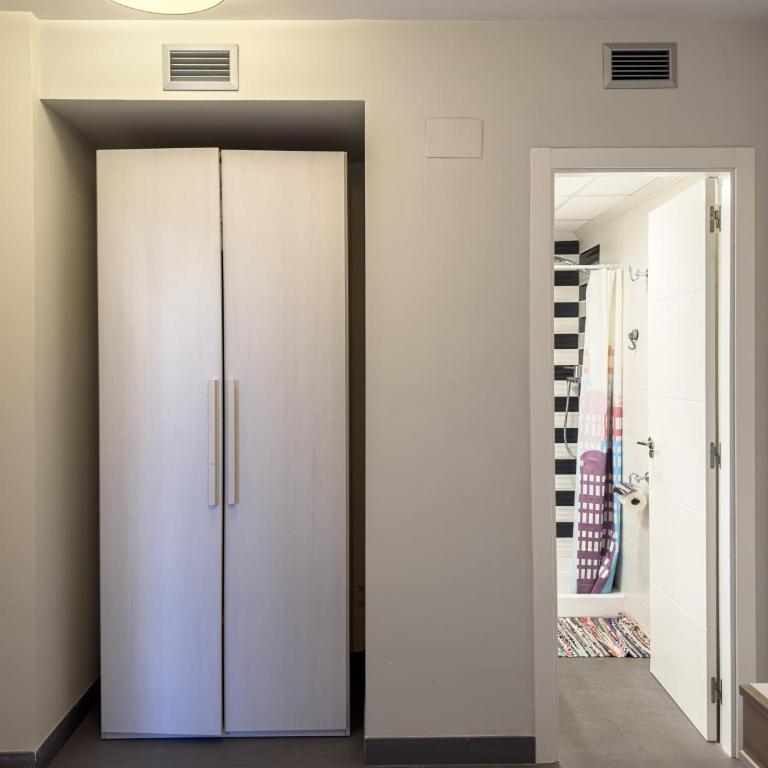 Apartamento con jardín en primera linea de playa con parking y piscina - Apartamento - Planta baja - 12