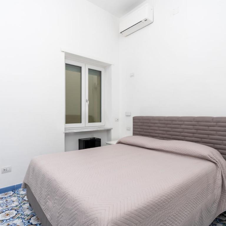 Guest House La Piazzetta - Camera Quadrupla Comfort - 1