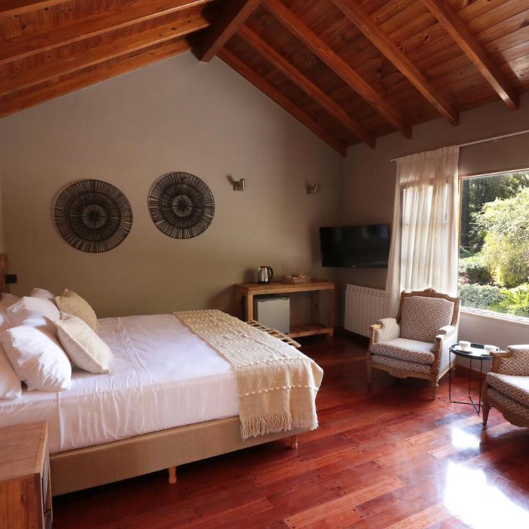 Heura Petit Hotel - Habitación con cama extragrande. - 1