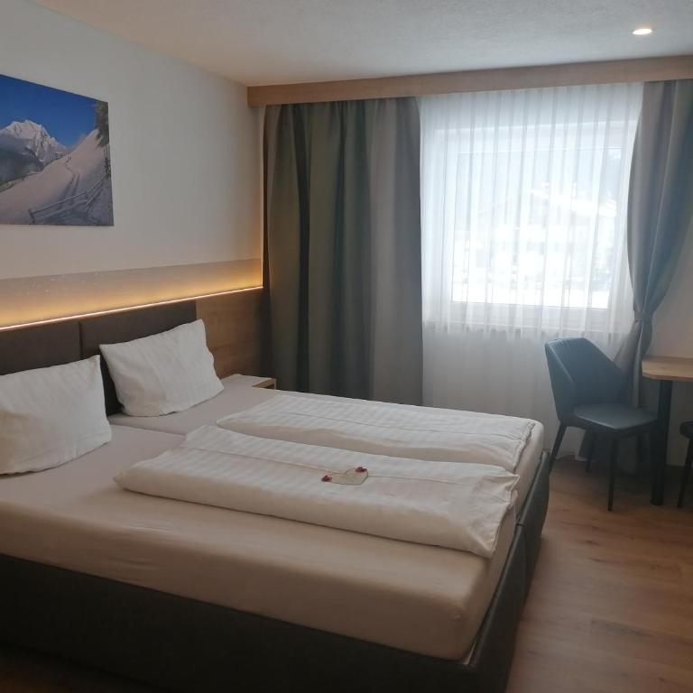 Gästehaus Holaus - Doppelzimmer mit Balkon - 21