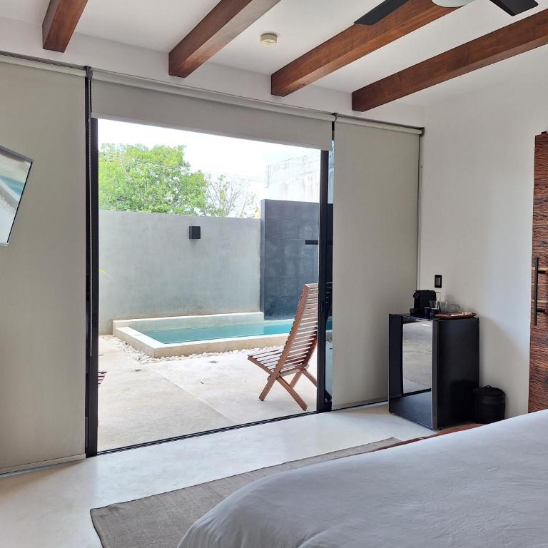 BT Rooms Tulum - Habitación con cama extragrande y vistas a la piscina - 20