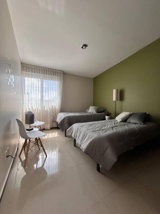 Nueva Galicia residencial, es una propiedad completa al sur de la ciudad que te ofrece modernidad, espacio, tranquilidad, cuenta con 4 recamaras 3 baños completos y 2 cajones de estacionamiento privados - Five-Bedroom House - 46