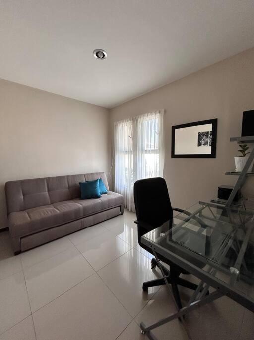Nueva Galicia residencial, es una propiedad completa al sur de la ciudad que te ofrece modernidad, espacio, tranquilidad, cuenta con 4 recamaras 3 baños completos y 2 cajones de estacionamiento privados - Five-Bedroom House - 57