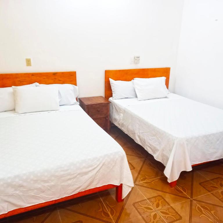 Hospedaje casa Yuca - Habitación Doble Estándar con 2 camas dobles - 2
