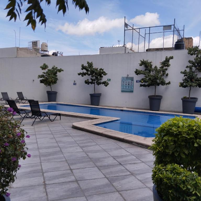 Céntrico y estiloso apartamento con Alberca, AC, Seguridad, Aparcamiento y Gym - Two-Bedroom Apartment - 24