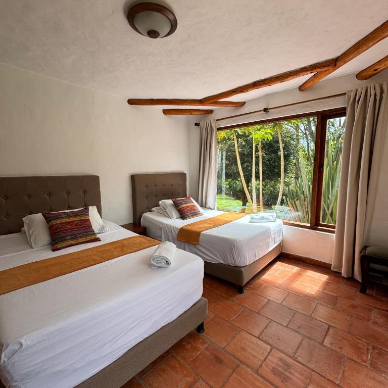 ApartaHotel La Leyenda - Two-Bedroom Apartment with Garden View - 3