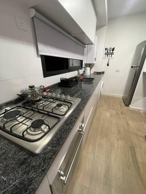 Semi Piso centrico con cochera - Apartamento de 1 dormitorio - 12