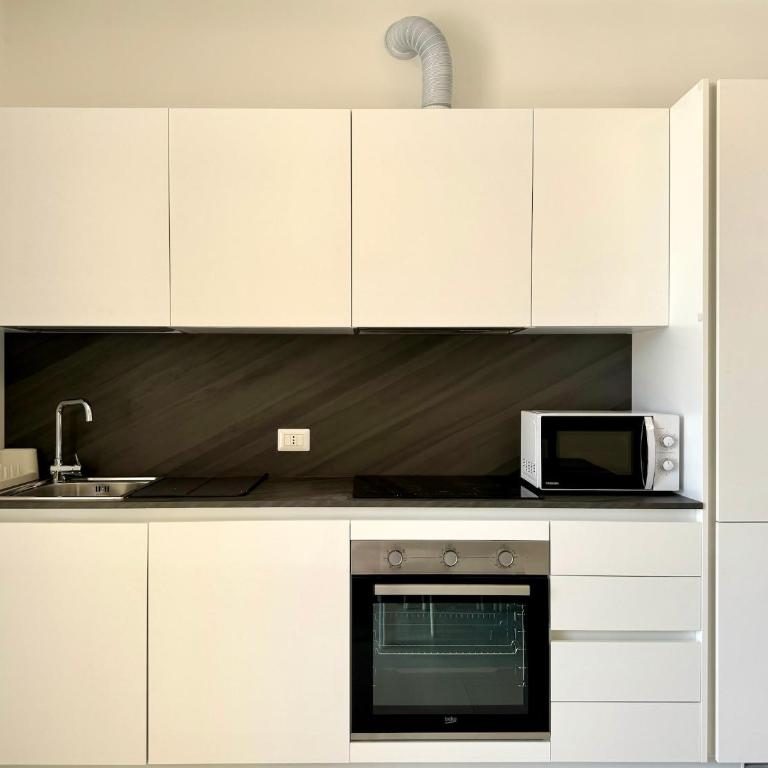 Residence Wave Island - Carraro Immobiliare - Family Apartments - Appartamento con 2 Camere da Letto e Vista Piscina - 6