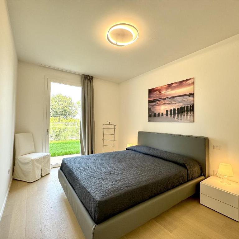 Residence Wave Island - Carraro Immobiliare - Family Apartments - Appartamento con 2 Camere da Letto e Vista Piscina - 19