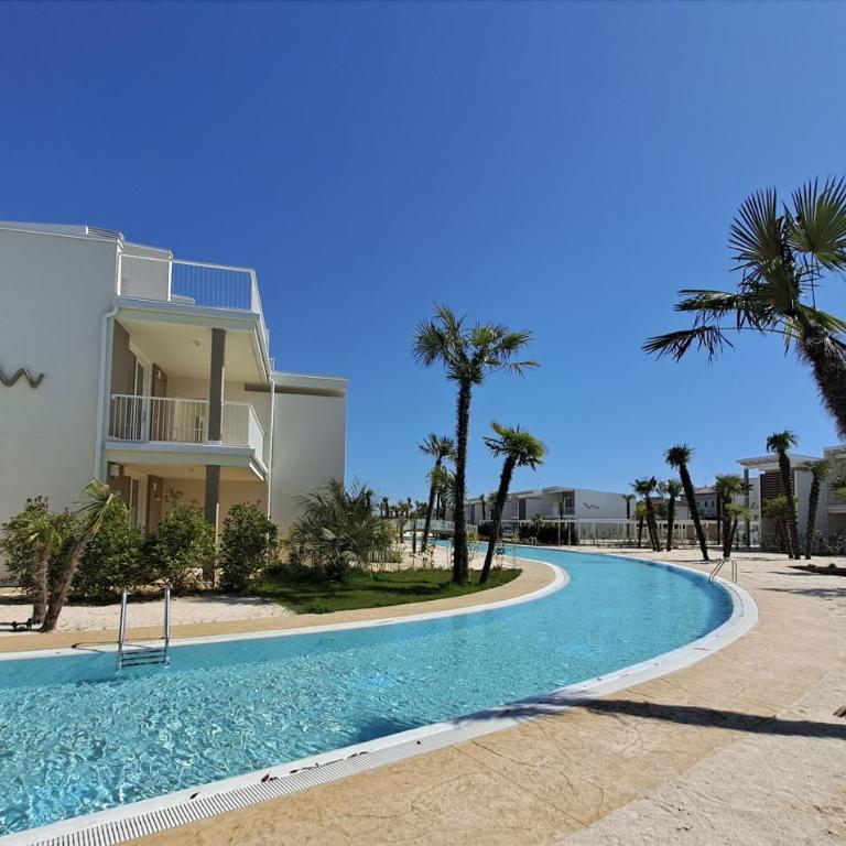 Residence Wave Island - Carraro Immobiliare - Family Apartments - Appartamento con 2 Camere da Letto e Vista Piscina - 17