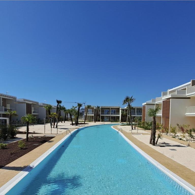 Residence Wave Island - Carraro Immobiliare - Family Apartments - Appartamento con 2 Camere da Letto e Vista Piscina - 15