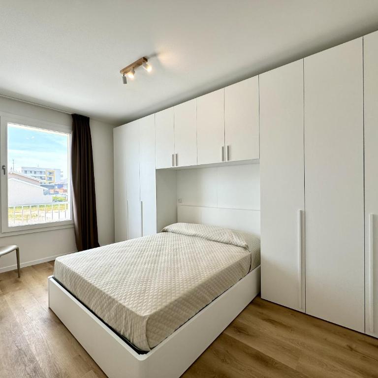 Residence Wave Island - Carraro Immobiliare - Family Apartments - Appartamento con 2 Camere da Letto e Vista Piscina - 22