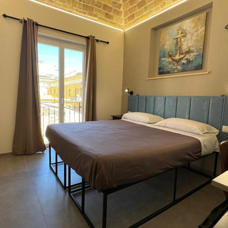 PescarAmare rooms - Camera Matrimoniale/Doppia con Letti Singoli con Vista Città - 1