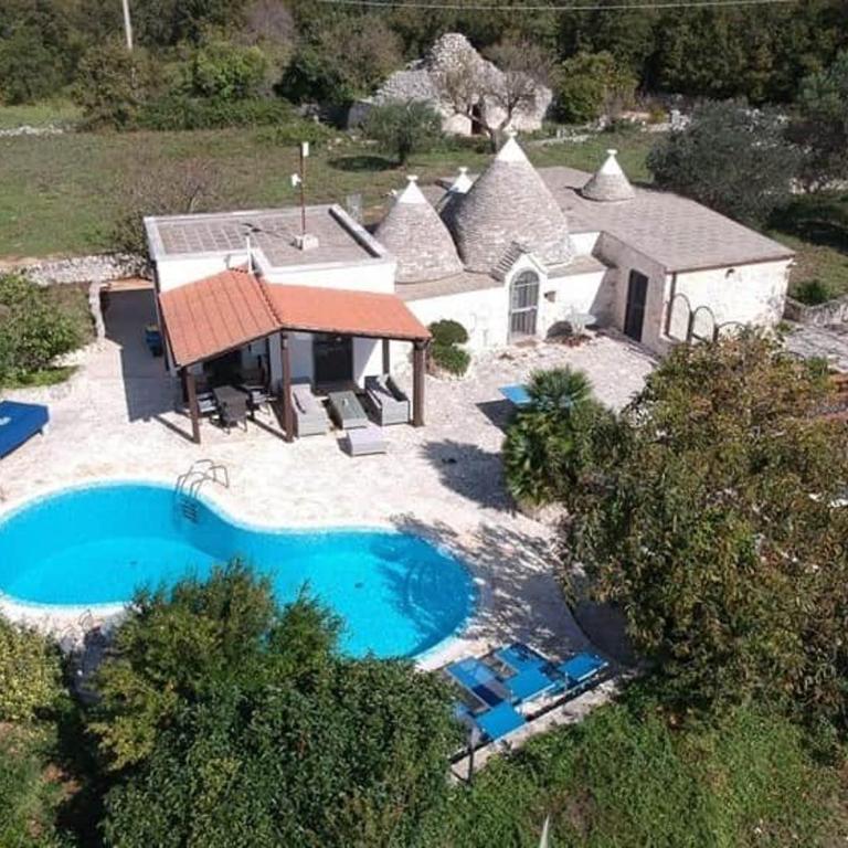 Trullo Olivia con piscina riscaldata, natura e relax - Three-Bedroom House - 48