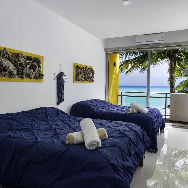 Angelina 28 Beachfront and Family Apartments - Modern and Relaxing Long Stays - 20 min from Cancun Airport - One-Bedroom Apartment with Sea View - 1