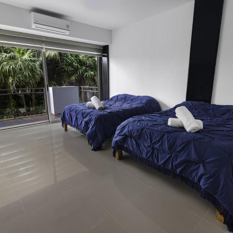 Angelina 28 Beachfront and Family Apartments - Modern and Relaxing Long Stays - 20 min from Cancun Airport - Two-Bedroom Apartment with Garden View - 4