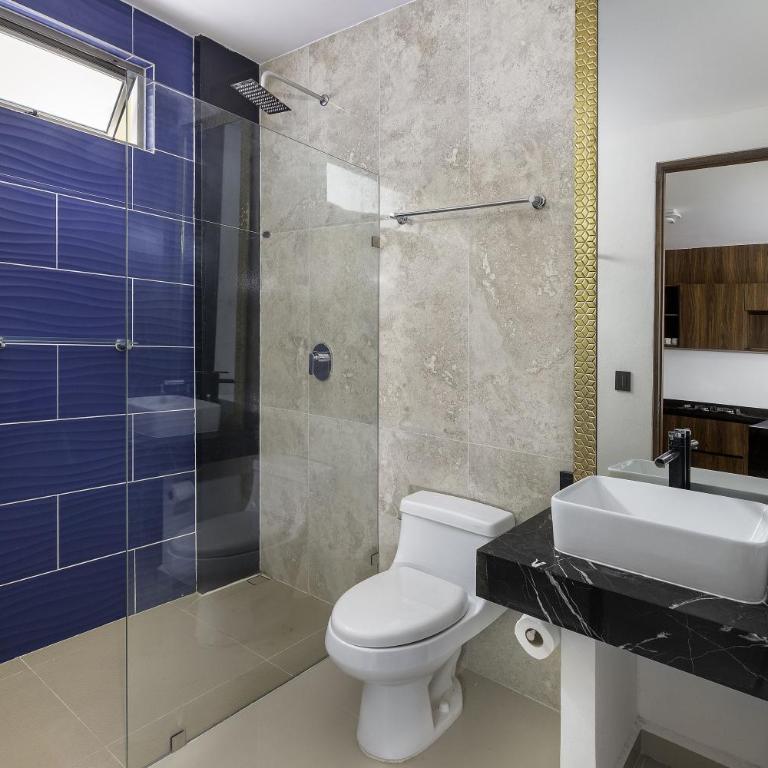 Angelina 28 Beachfront and Family Apartments - Modern and Relaxing Long Stays - 20 min from Cancun Airport - Two-Bedroom Apartment with Garden View - 5