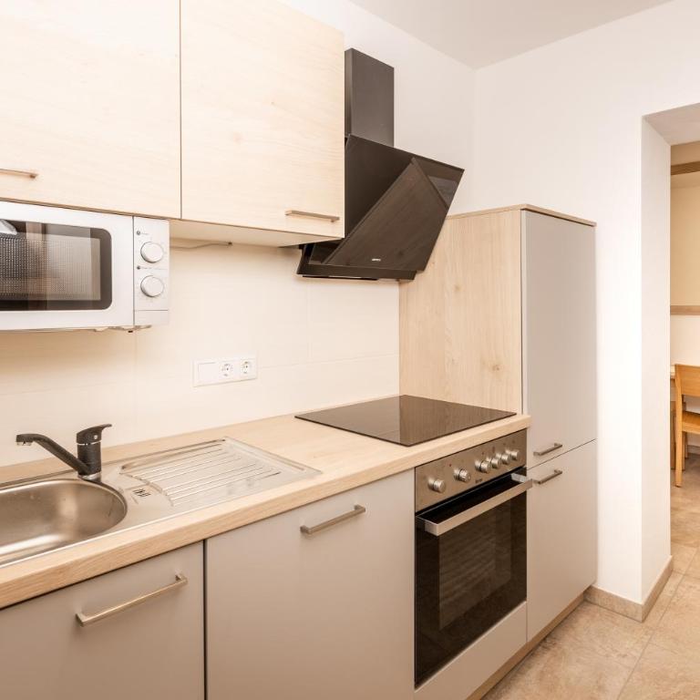 Mentenwirt Pension&Appartements - Apartment mit 2 Schlafzimmern und Gartenblick - 1