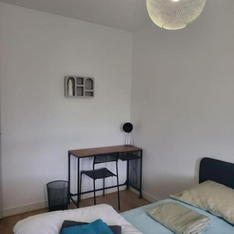 Le Temps d'un Séjour Clermont-Ferrand F3 2 chambres 1 chambre avec 1 lit simple et 1 chambre avec 2 lits doubles et 1 Garage - Appartement 2 Chambres - 14