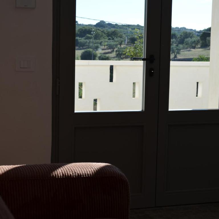 B&B Fuga al Trullo - Appartamento Deluxe con 2 Camere da Letto e Vista Giardino - 8