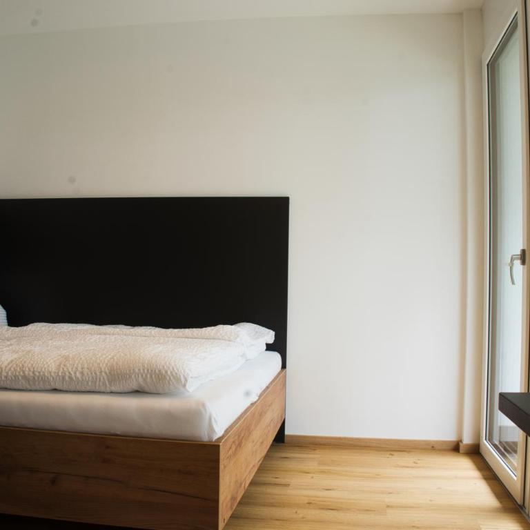 myQuartier City Chalets digital self check in - Studio M mit Balkon - 1