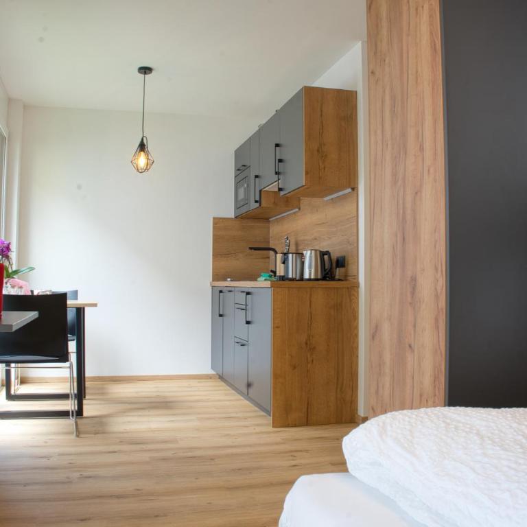 myQuartier City Chalets digital self check in - Studio M mit Balkon - 2