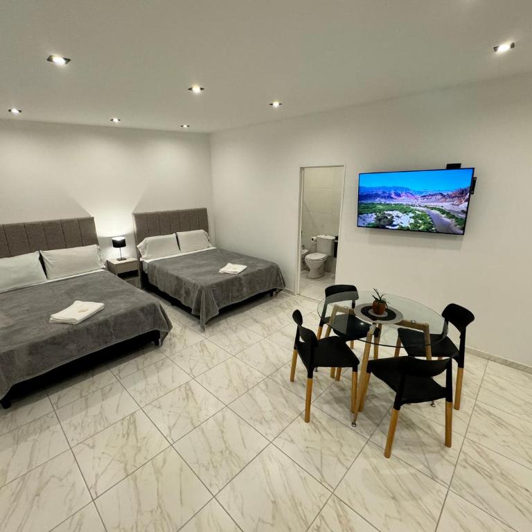 URBANA PREMIUM SUITES Apartamentos de Categoría Parking Privado - Seguridad - Sanatorio Allende - Hospital Privado - Estadio Kempes - Universidad Siglo 21 - Complejo Ferial Córdoba - Quorum - Aeropuerto Internacional Taravella - Habitación con 2 camas grandes - 4