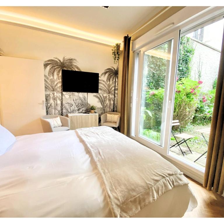 Chambre Cosy chez l habitant avec salle de bain et jardin privé - Chambre Lit Queen-Size - Vue sur Jardin - 4